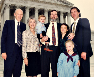 Al Simpson, his wife, sons and grandchildren stinding on the steps in front of the US Supreme Court