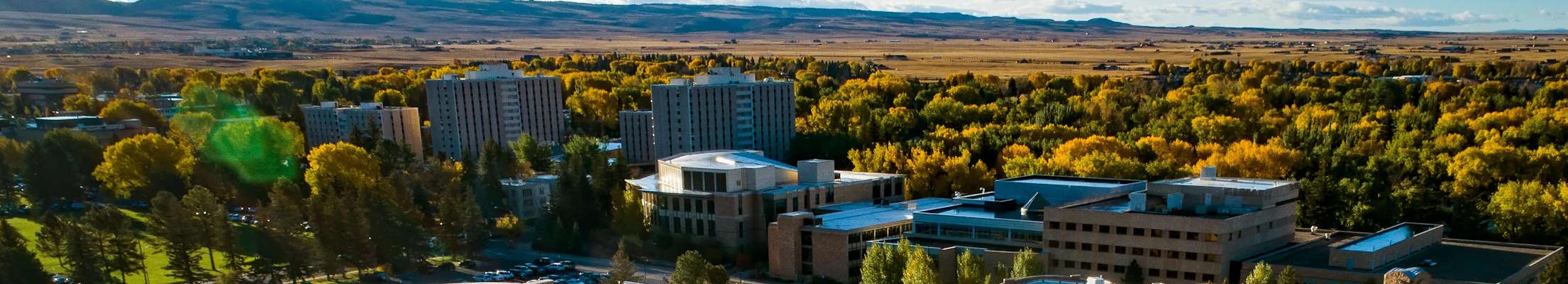 aerial view of UWYO campus with autumnal aspen and plains in the background