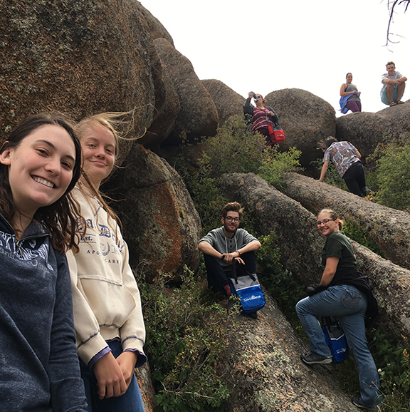 students climb rocks at Vedauwoo State Park during 2019 UW Summer Bridge