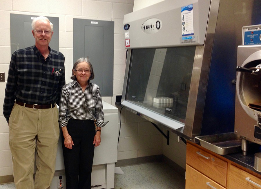 NWC INBRE lab with researchers posing with lab equipment
