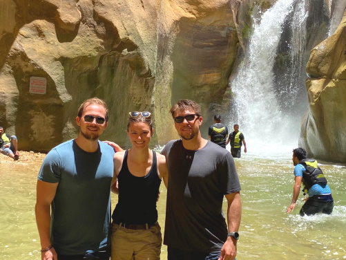 students at a waterfall in jordan