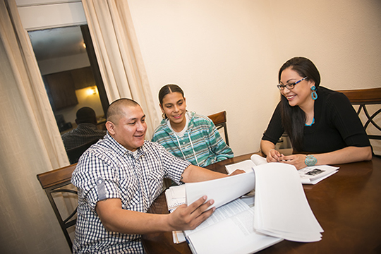 student reviewing documents with family