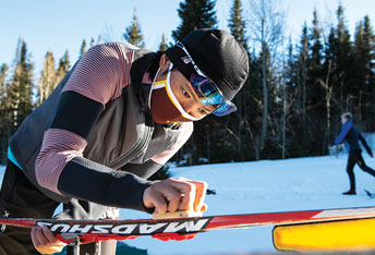 person waxing skis
