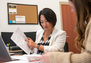 Faculty member helping student