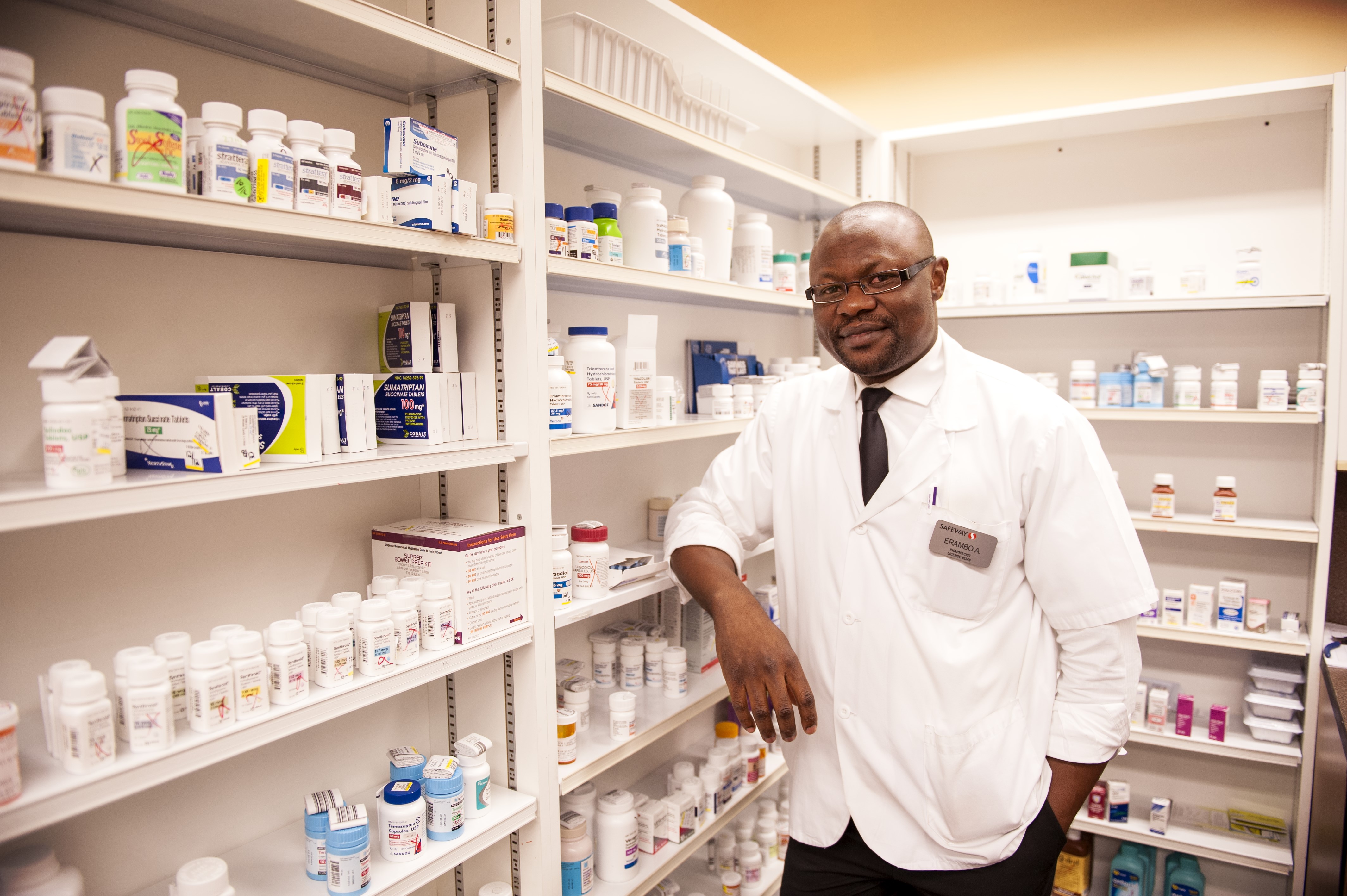pharmacist standing in a pharmacy