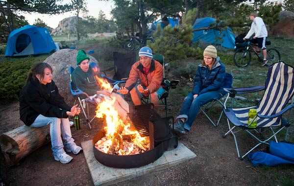 Students sitting around campfire
