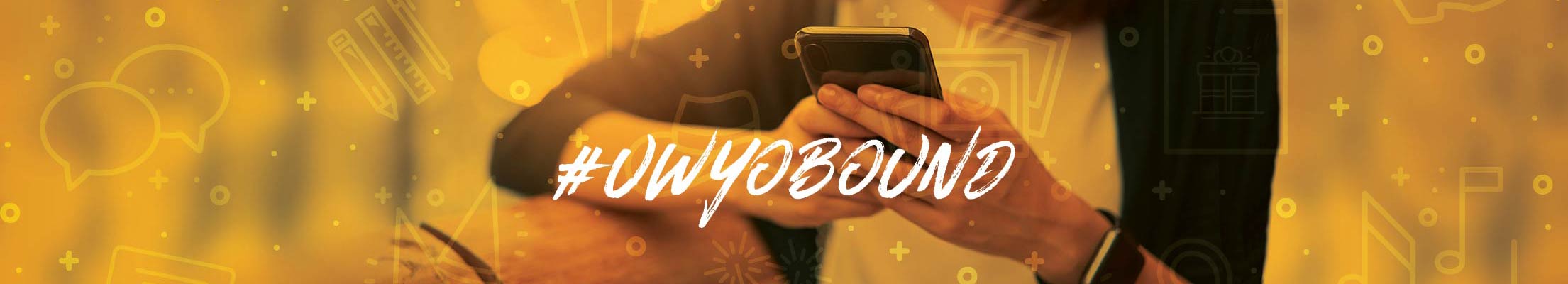 A girl uses her smarthphone with the hashtag #uwyobound over top