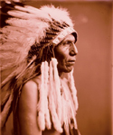 Profile of native American with feather head dress