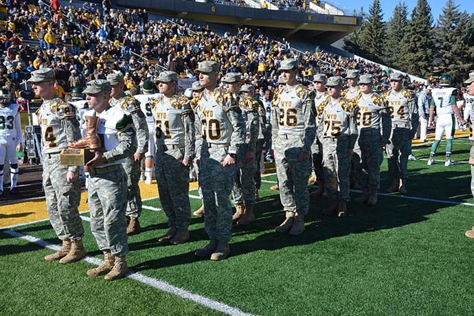 Army ROTC Cowboy Battalion  marching with the bronze boot