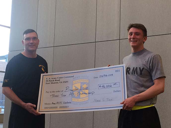 Army ROTC cadet receiving scholarship