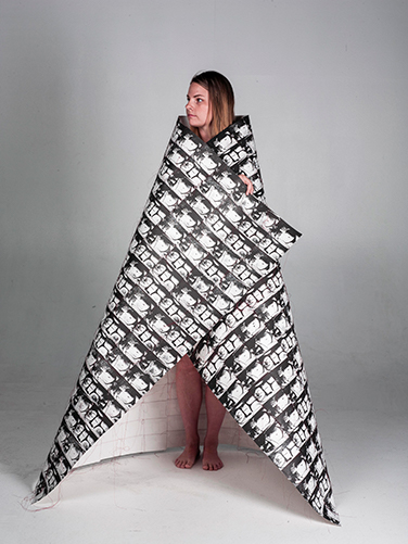 Woman wrapped in quilted prints