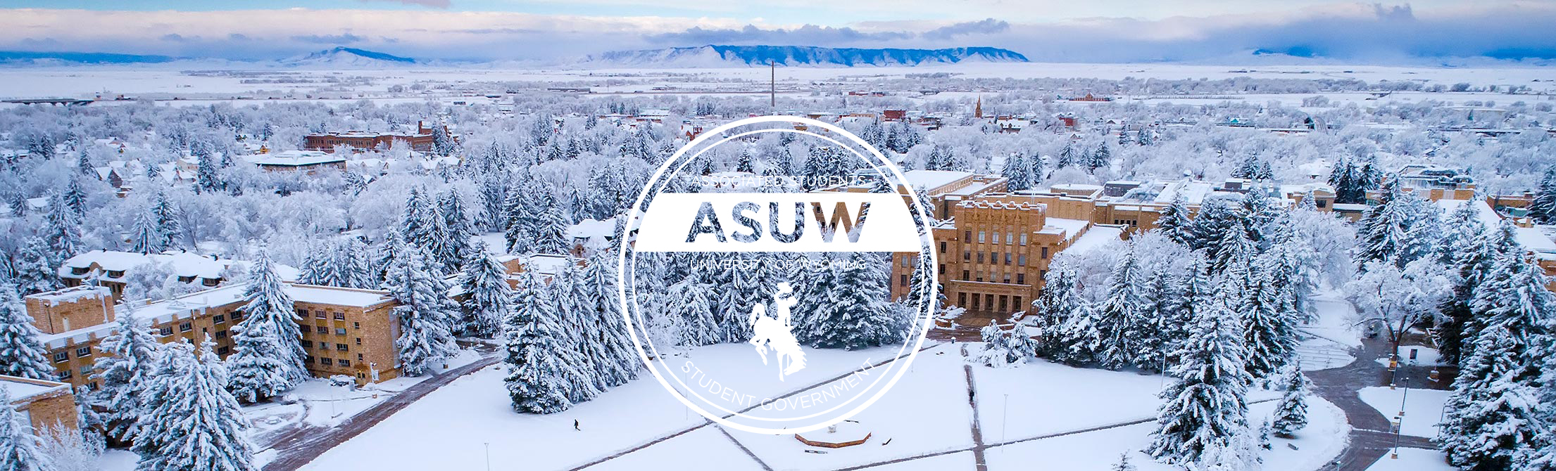 Aerial view of snowy campus with ASUW logo