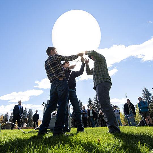 atmospheric science students work on balloon experiment