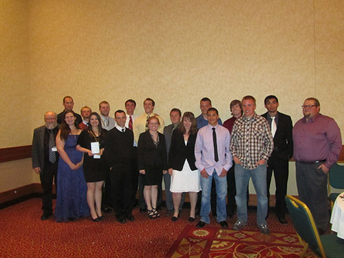 students & faculty posing in closing banquet photo