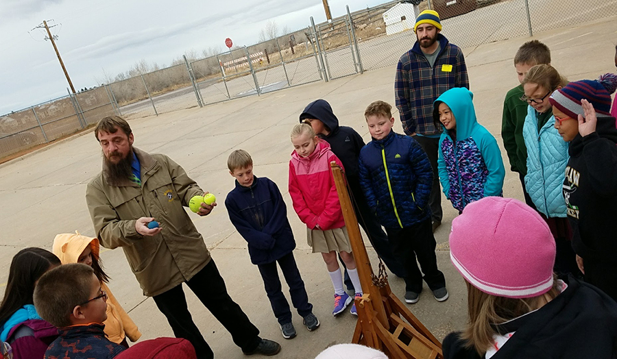 Ryan Kobbe helping Snowy Range Academy students on Trebuchet Day