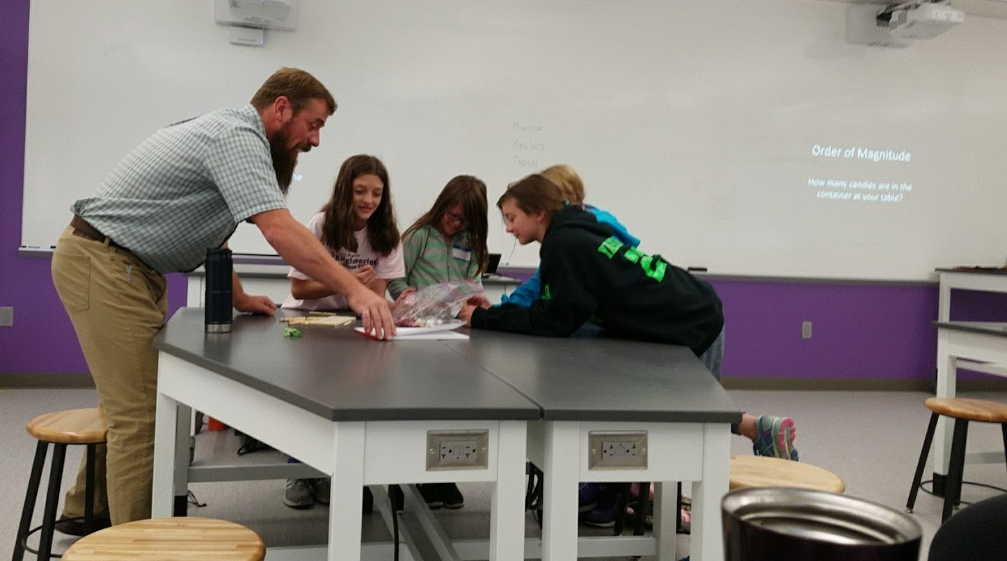 Ryan Kobbe helping female students during Women Engineering Day