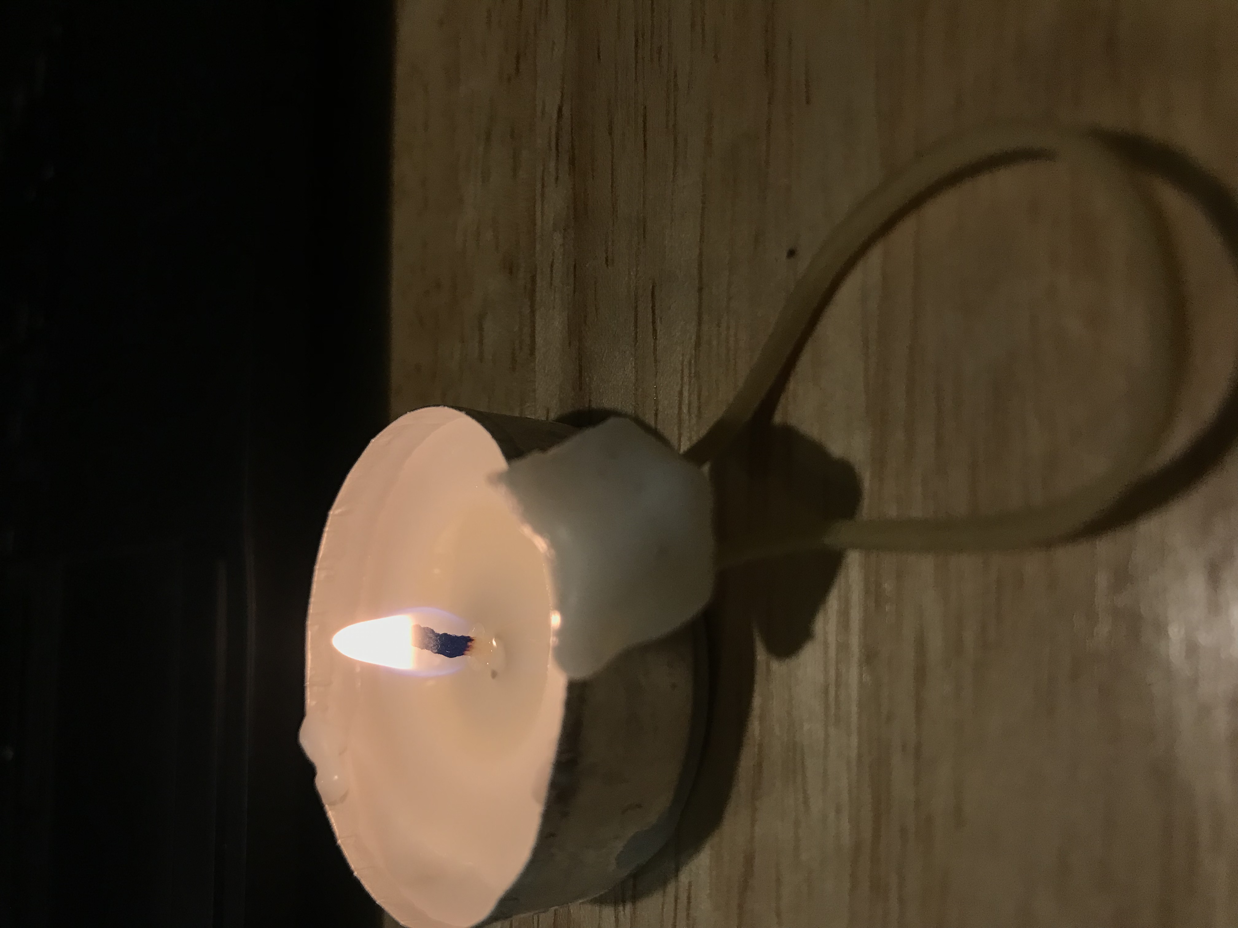 a tealight candle burning