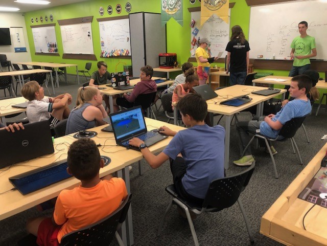 Teachers lead a coding activity