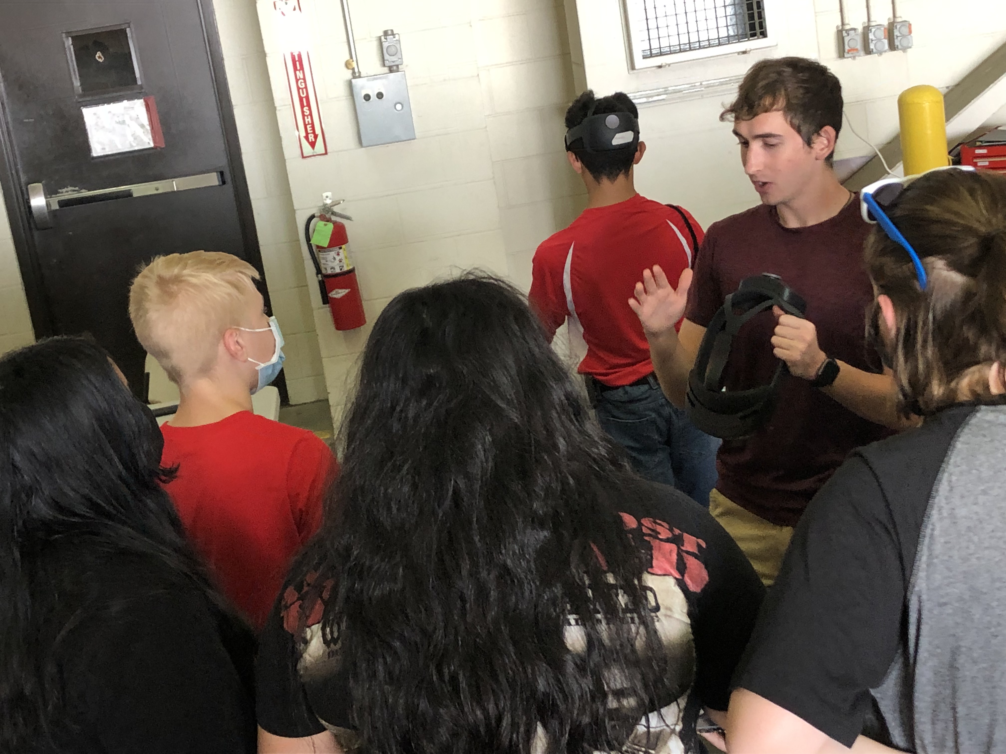 student explains AR to high school learners