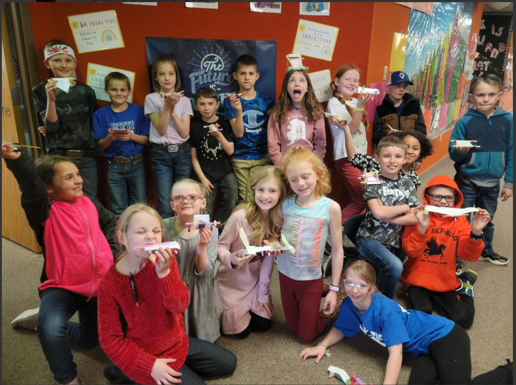 Group photo of students with catapults