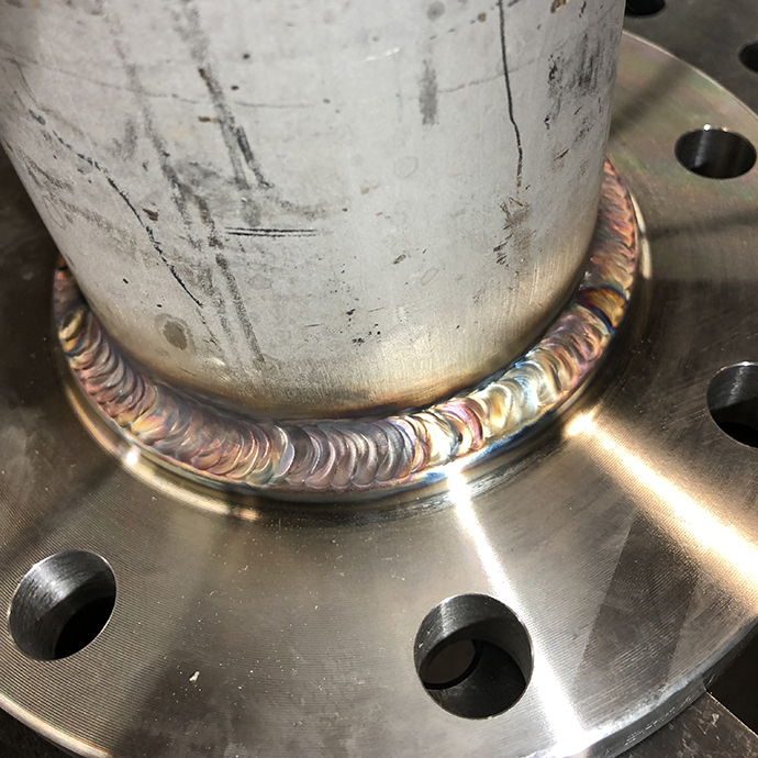 TIG welding stainless steel pipe flanges for Chemical Engineering’s Coal Extraction Pilot Plant