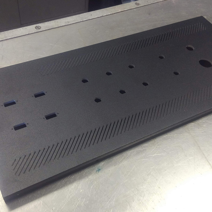 Waterjet machined connector cutouts in black satin finish electrical cover panels