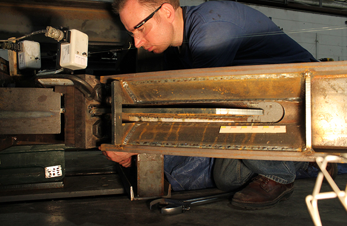 A student tests building materials in the Engineering Building. 