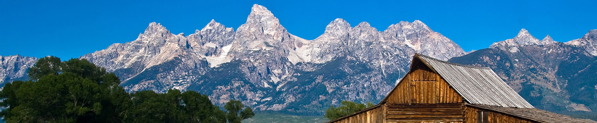 Tetons with cabin in foreground