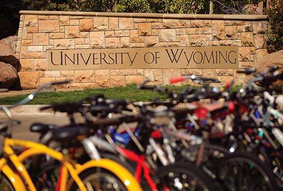 Bikes in front of the University of Wyoming sign