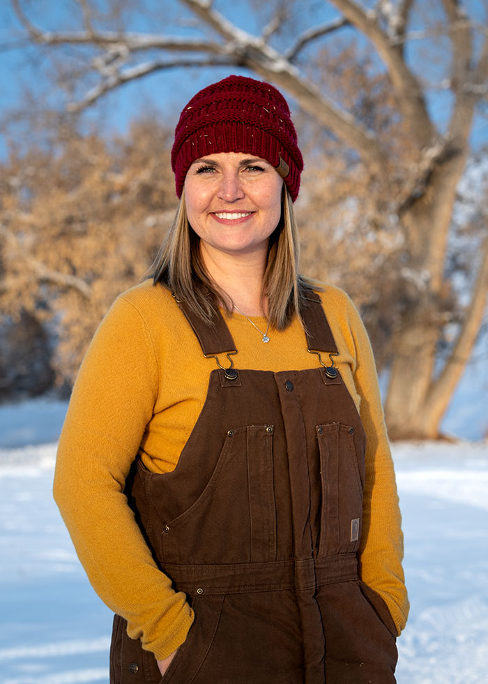 Abby O'Donnell standing outside on her farm