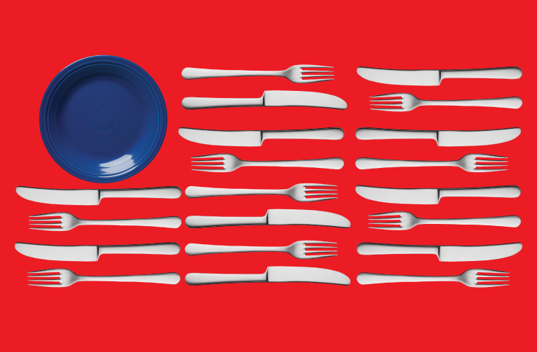 plate, forks and knives arranged to look like the American flag