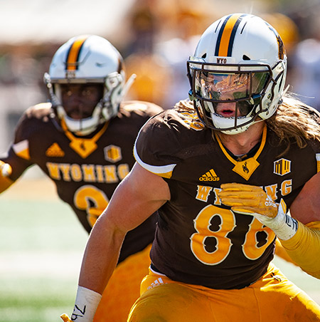 Two Wyoming Cowboys Football players
