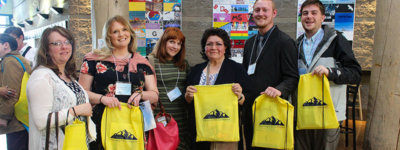 2018 Wyoming ESL Conference Attendees hold their bags