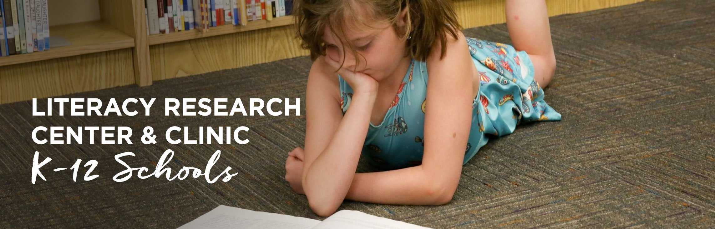 Teacher tutoring students with wording: Literacy Research Center & Clinic K-12 Schools