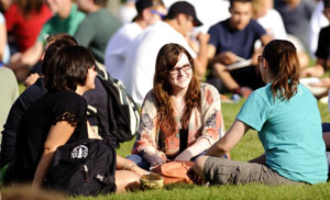 students sit and talk in Prexy's Pasture