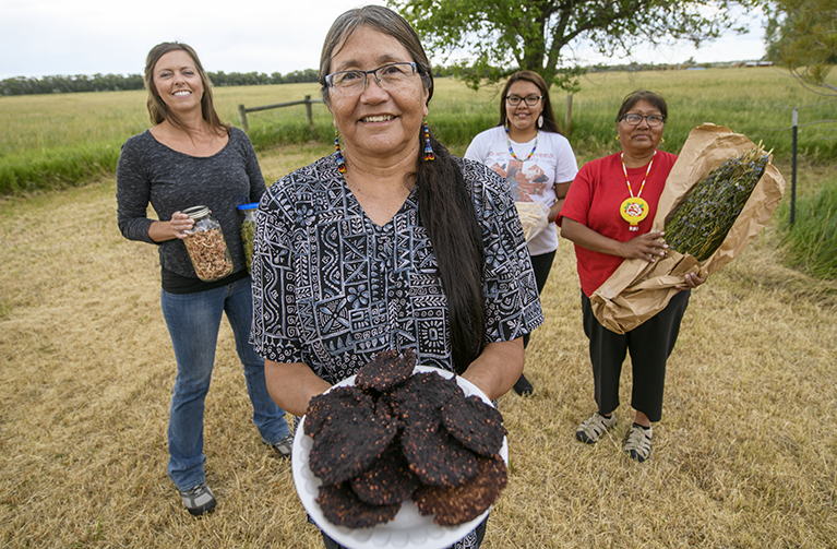 dr. jill keith professor of human nutrition and food in the department of family and consumer sciences with three native american women on a local ranch