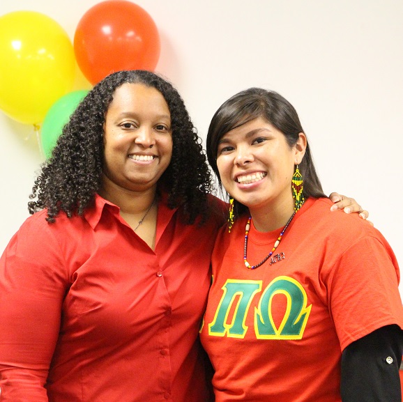 Two members of Alpha Pi Omega in letters