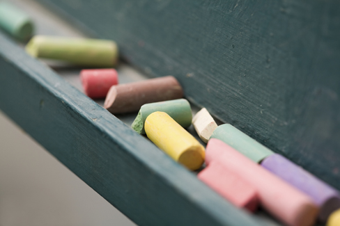 close-up of chalk at chalkboard