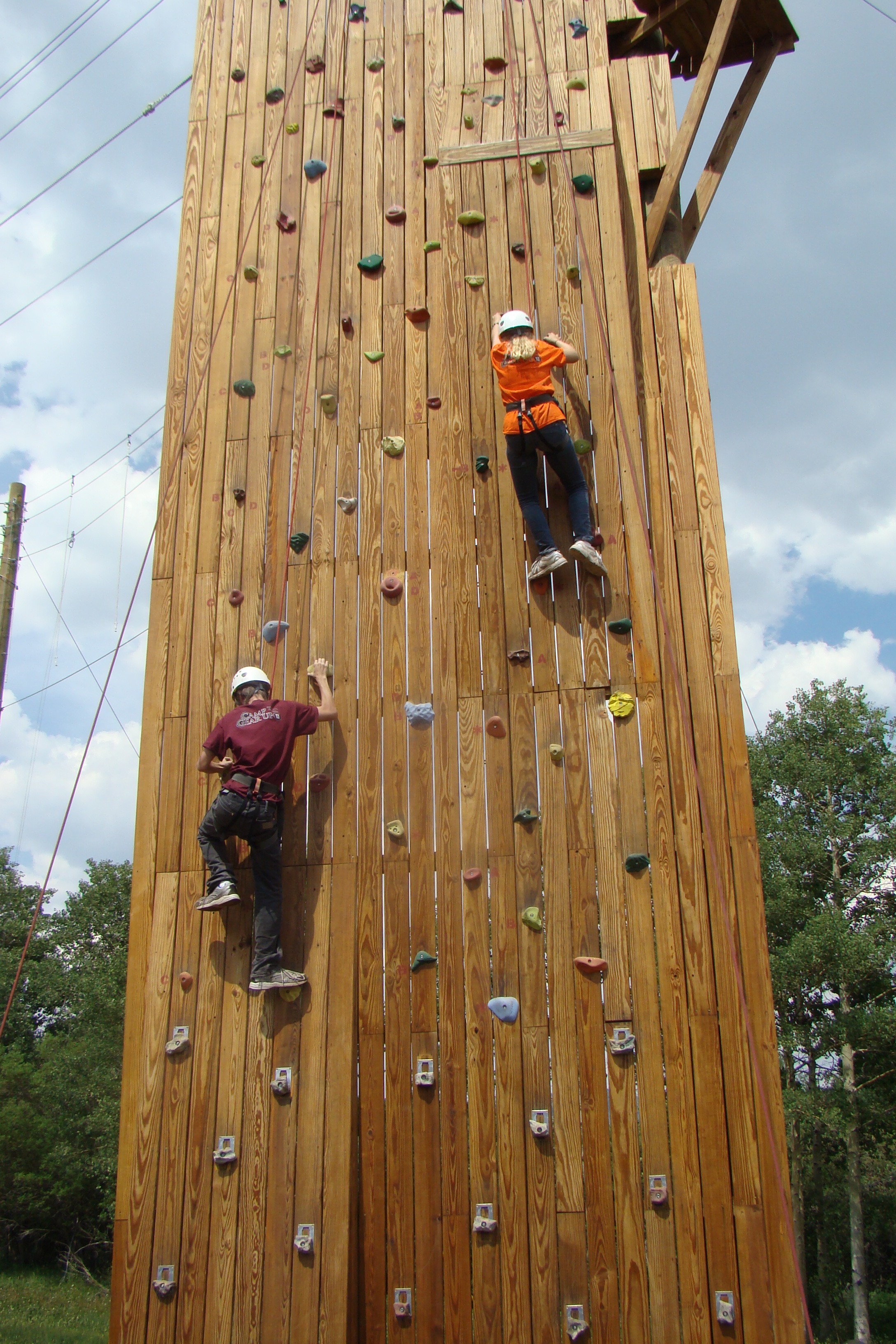 GEAR UP Students climbing a wall during summer camp