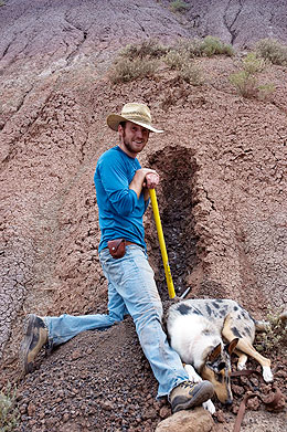 Brady Foreman, a UW doctoral student, obtains samples for carbon isotope analyses, with dog.