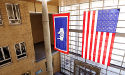 Wyoming and U.S. flag hanging in building
