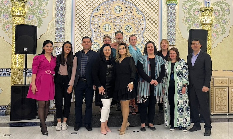 tour group with alumni group photo in Tashkent