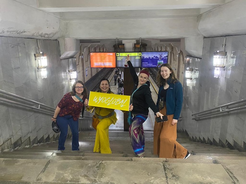 four women on steps in a Tashkent subway station