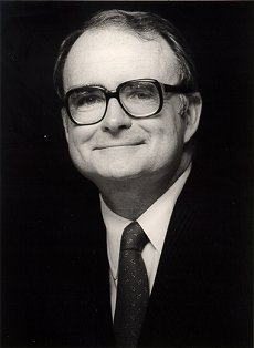Bill Ruckelshaus in a suit, black and white.