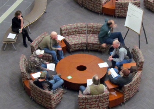 People sitting at a round table collaborating