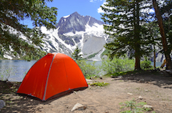 Tent pitched near alpine lake, Wind River Mountains, Wyoming