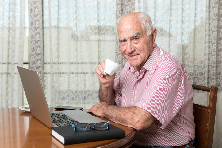 Older man taking class online