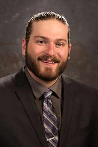 Student in black suit