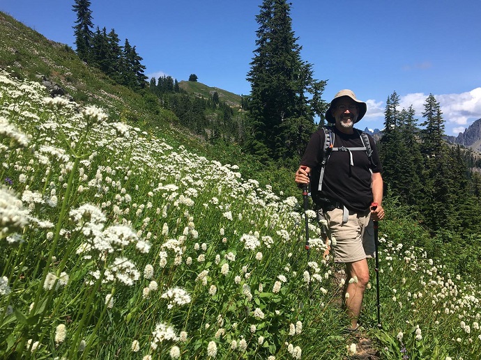 Jeffrey Lockwood surrounded by wildflowers