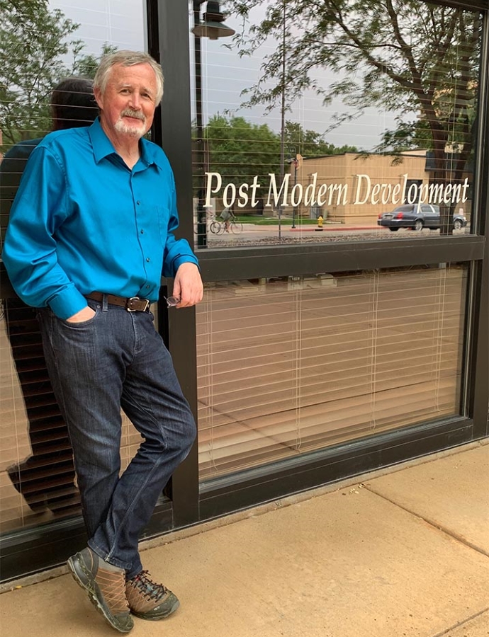 Man standing in front of a window and building